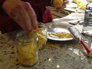 Filling jars with lemon skin