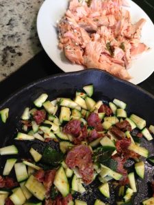 Zucchini with fried chorizo and salmon on the side